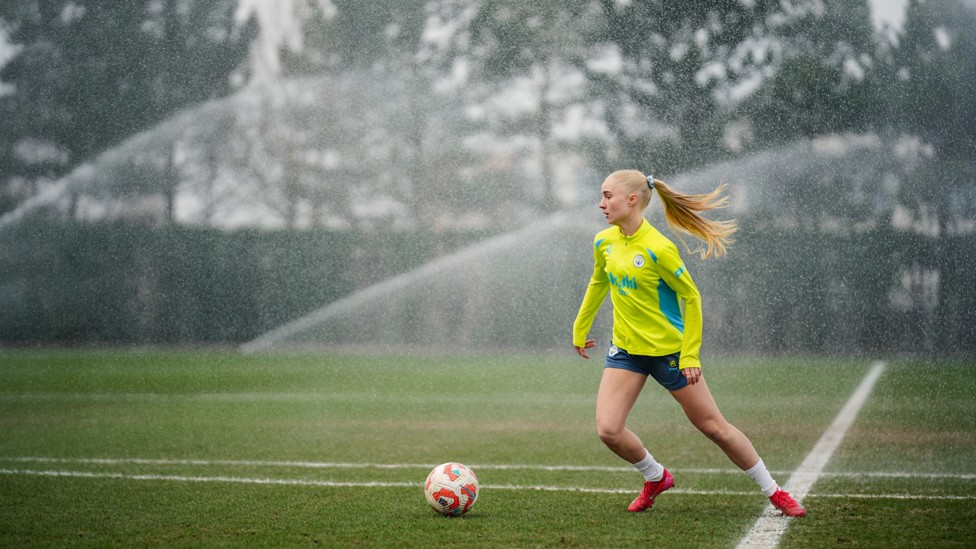 SPRINKLING MAGIC : Laura Blinkilde-Brown avoids the fountains