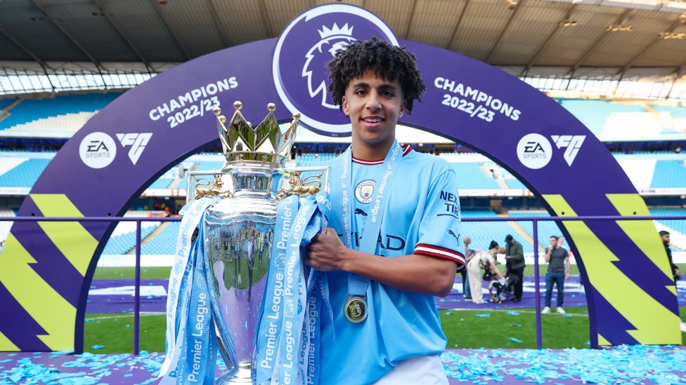 FIRST ONE DOWN : Lewis celebrates the Premier League title in his breakthrough campaign. 