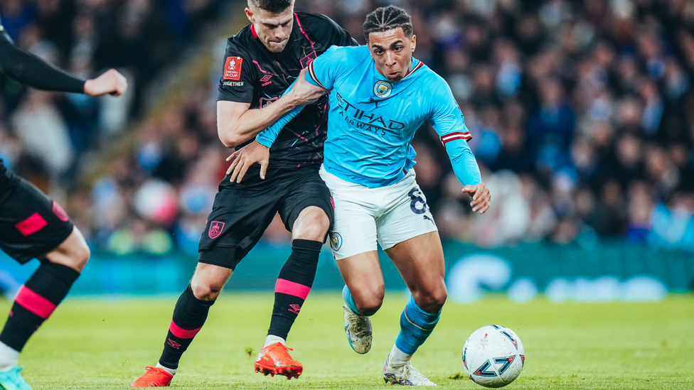 ACTION MAN: Rico Lewis drives City forward.