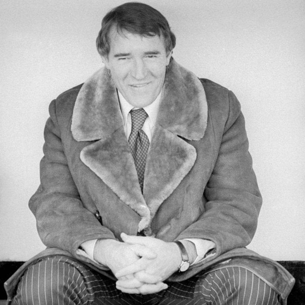 LEADING MAN: Allison is all smiles as he sits in the Maine Road dugout