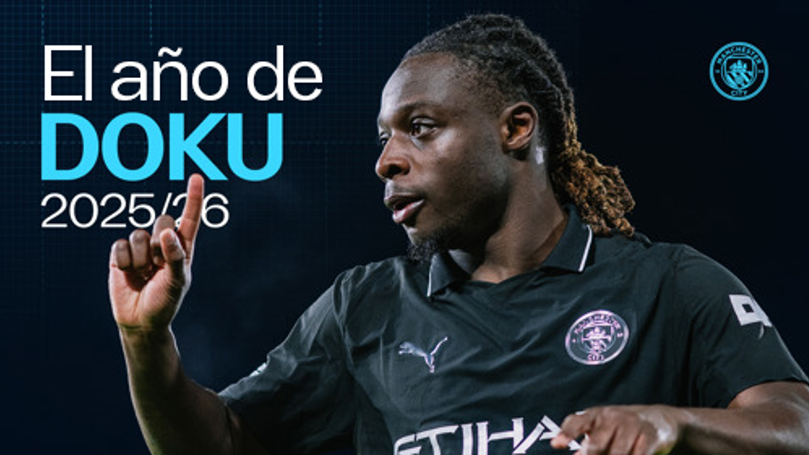 An image featuring a football player wearing a dark jersey with visible text 'El año de DOKU 2025/26' and a Manchester City logo in the top right corner.