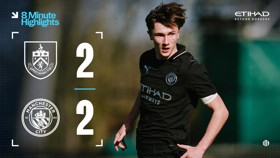 A graphic displaying the score between Burnley FC and Manchester City with both teams scoring 2 goals each. The player is wearing a Manchester City jersey with sponsors and logos visible.