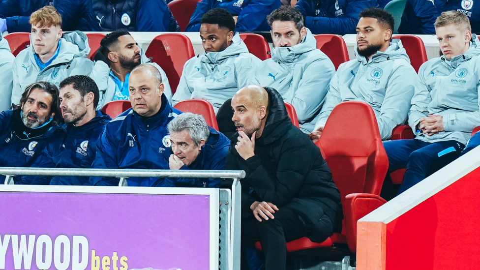 SURVEYING THE TROOPS : Pep and his staff watch on as we go into half-time ahead. 