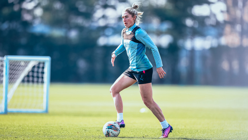 IN POSSESSION : Laura Coombs searches for a pass.