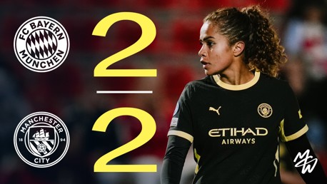 Image featuring a Bayern Munich vs Manchester City match score of 2-2, with a Manchester City player in the foreground wearing a black kit.