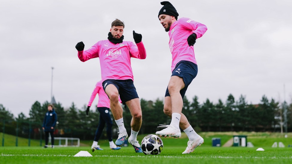 DOUBLE TROUBLE : Rayan Cherki comes up against Ruben Dias in training