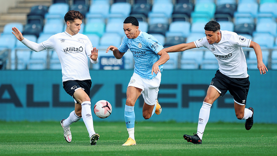 WINGING IN: Sam Edozie runs at the Derby defence