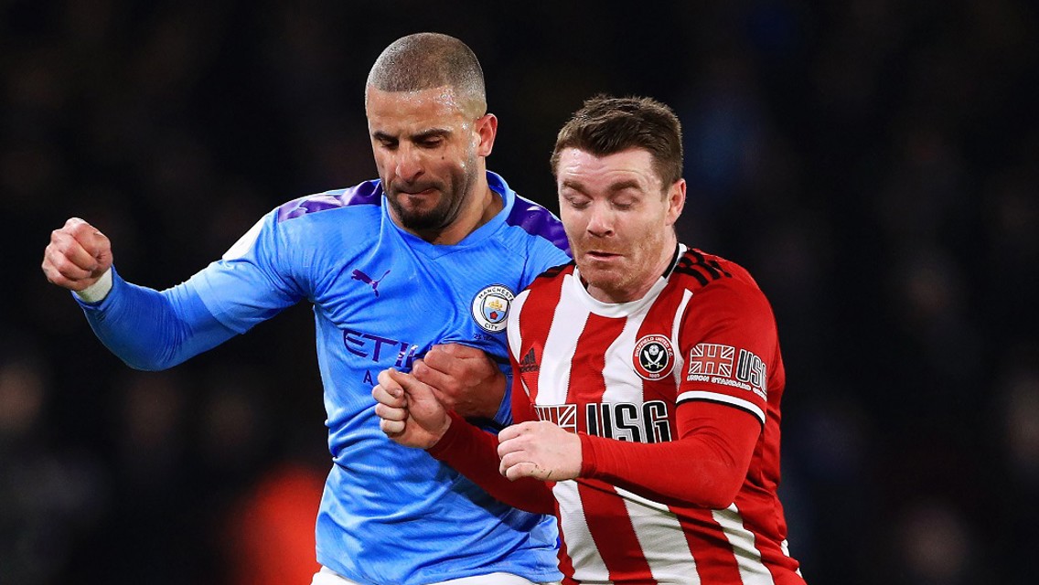 FLASHING BLADE: Kyle challenges for the ball at the stadium he once was a fan at