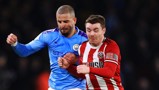 FLASHING BLADE: Kyle challenges for the ball at the stadium he once was a fan at
