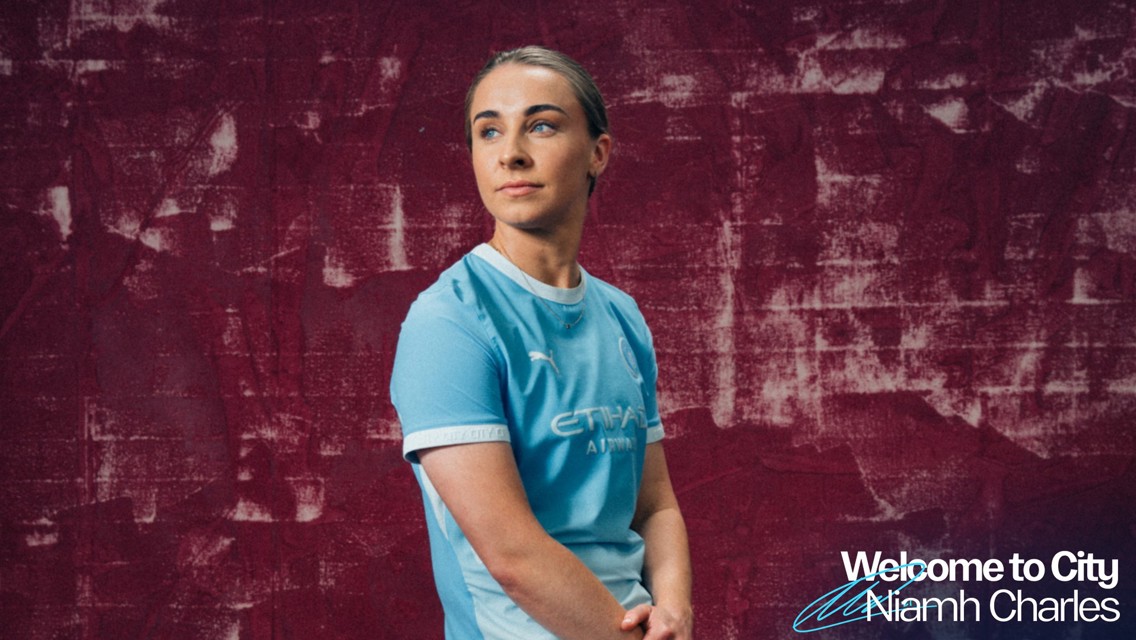 A person wearing a Manchester City jersey with blurred face in front of a textured maroon background, and text says 'Welcome to City Niamh Charles'.