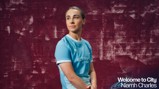 A person wearing a Manchester City jersey with blurred face in front of a textured maroon background, and text says 'Welcome to City Niamh Charles'.