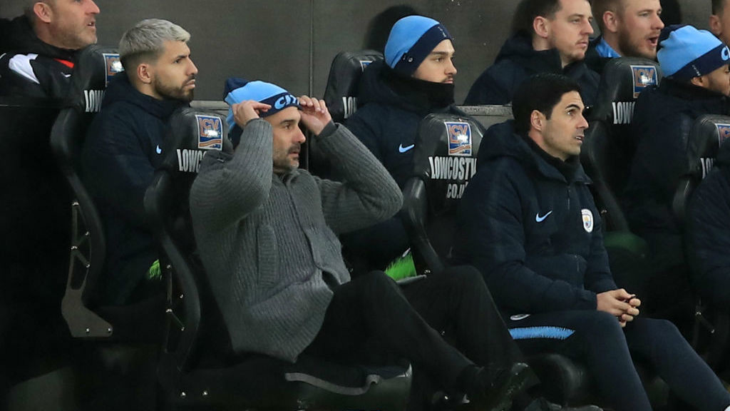 CHALLENGE: Pep Guardiola and the Blues bench look on in dismay after Swansea's second goal
