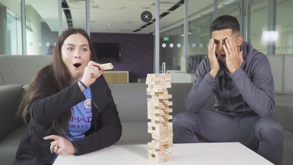 TENSION: Joao Cancelo tries his hand at Jenga.