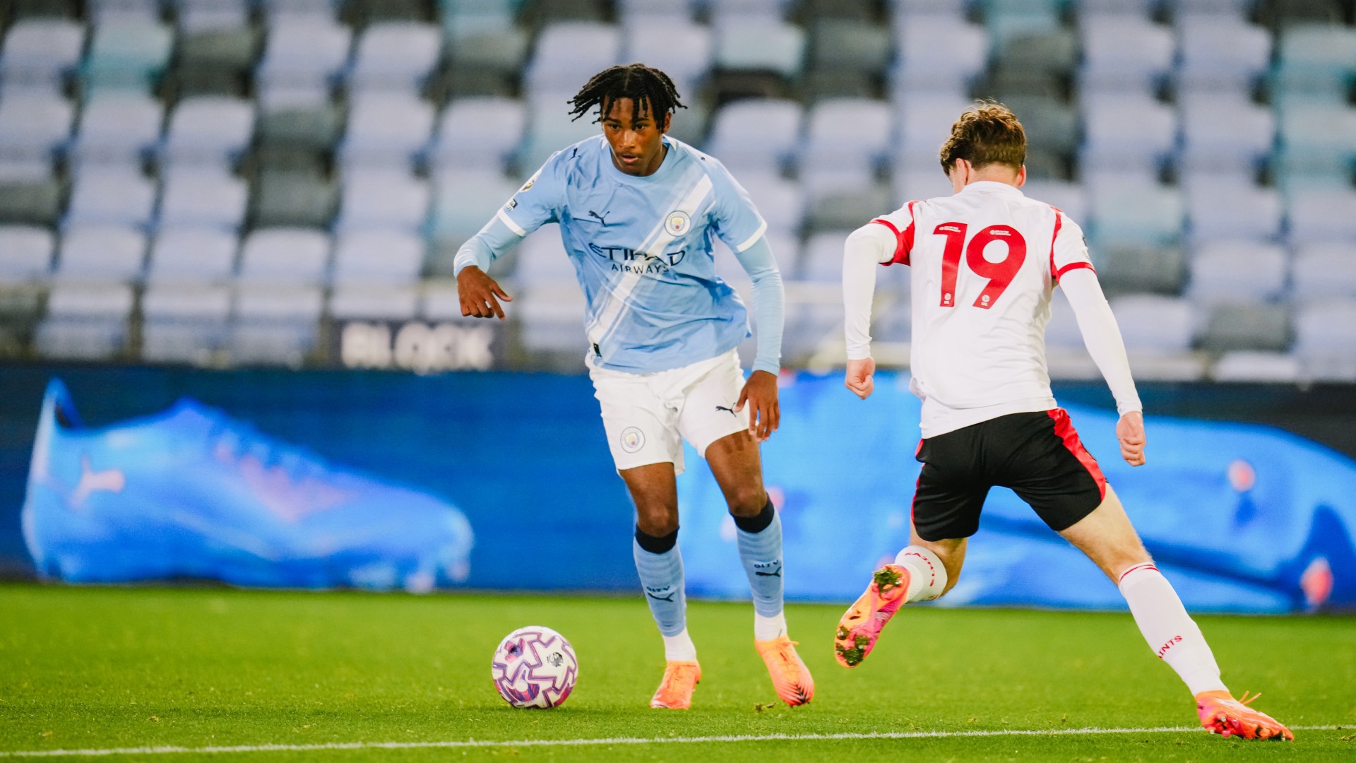 DANCING HESKEY : Reigan Heskey takes on his man.