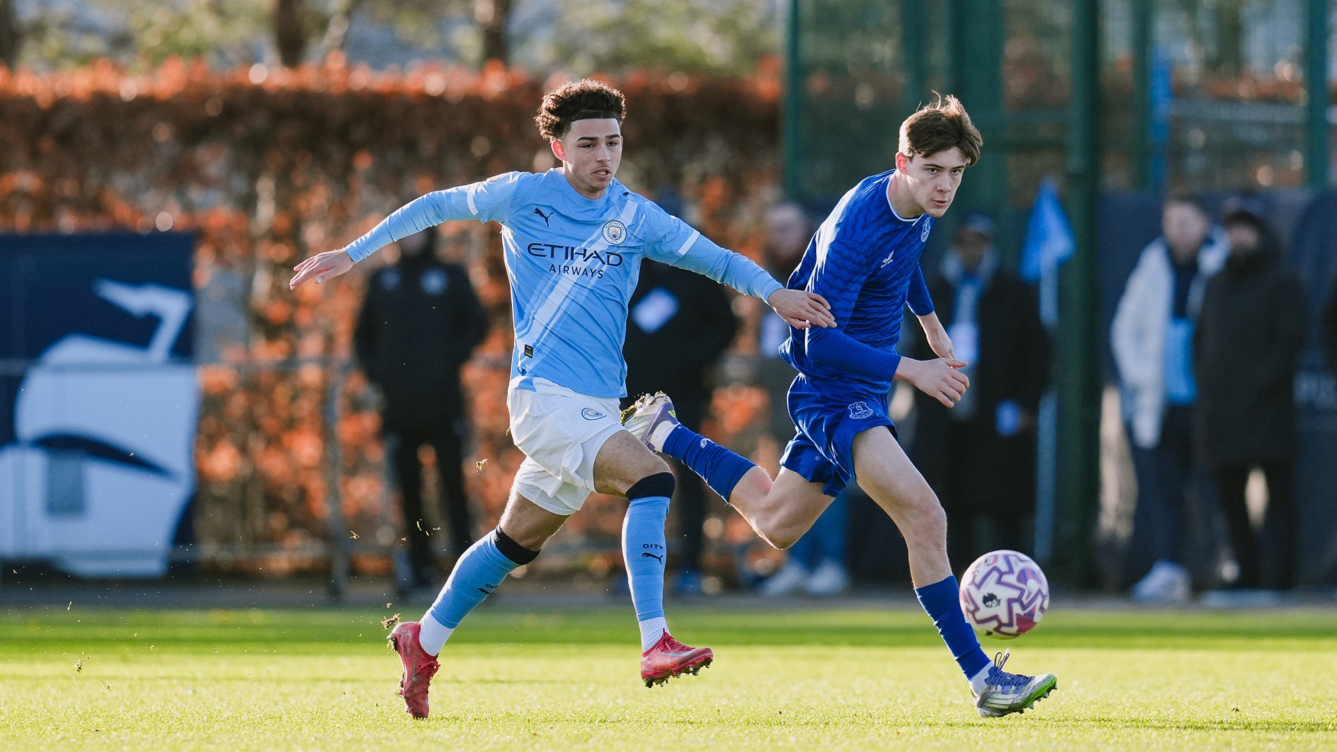 LEADING THE LINE : Kylan Midwood puts pressure on Everton's defence.