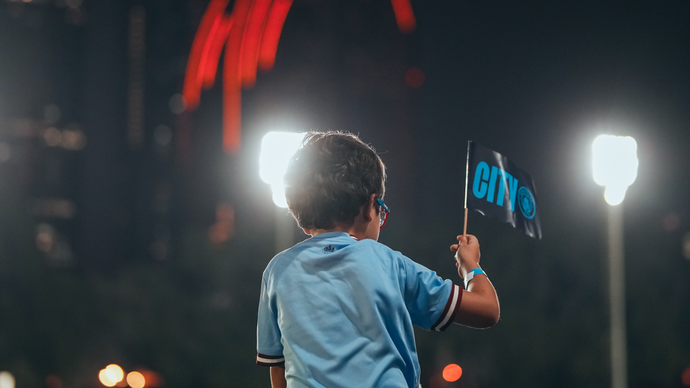 BLUE BOY : A young fan cheers as he gets a glimpse of his heroes