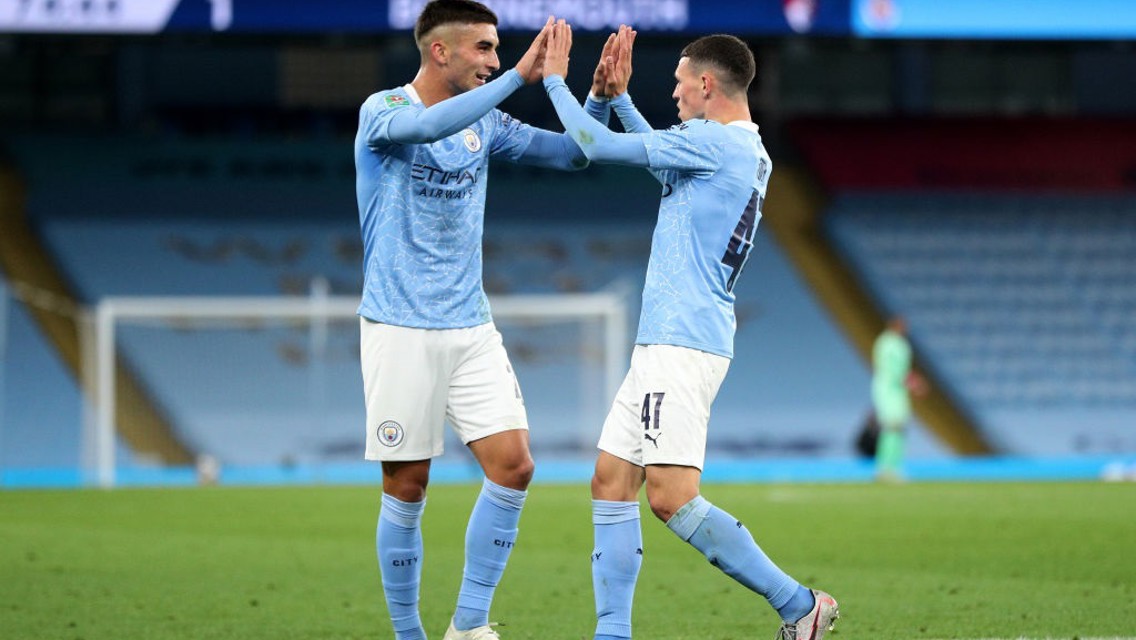 Ferran Torres congratulates goal-scorer Phil Foden