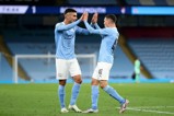 Ferran Torres congratulates goal-scorer Phil Foden