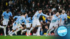 Manchester City players in light blue jerseys celebrating a victory on the field with a visible 'Official Verdict' badge.