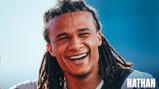 A smiling person with dreadlocks is captured in close-up with a gradient blue background and text reading 'Thank You Nathan'.