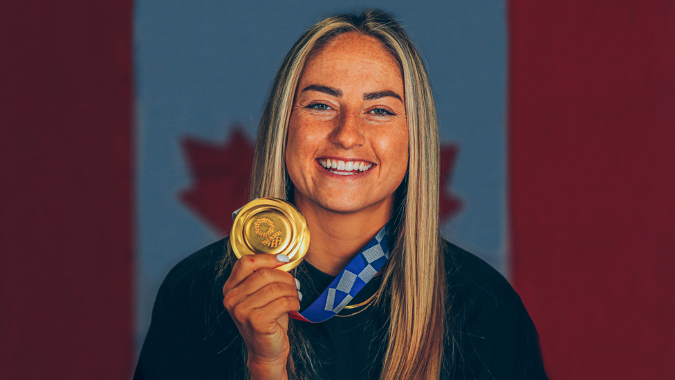 OLYMPIC GOLD : Janine Beckie poses with her medal after helping Canada achieve gold at the Tokyo Olympics, 6th August 2021.