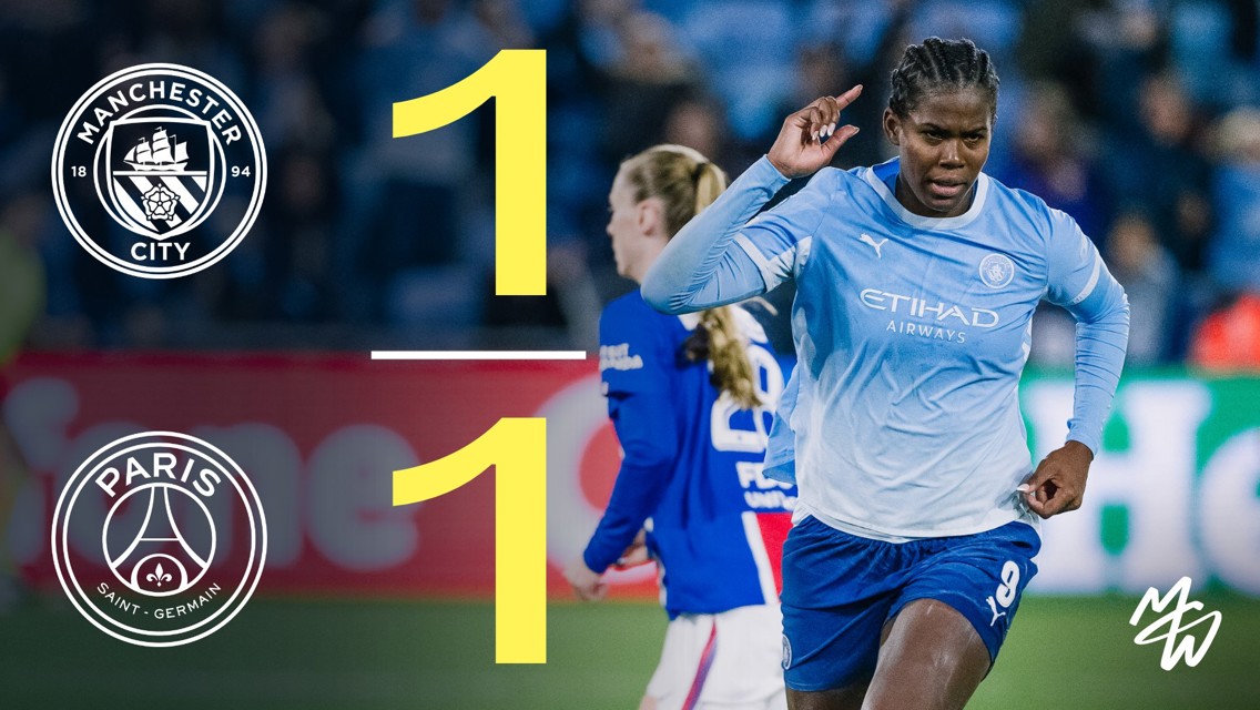 Manchester City Women's team player celebrating after a match with PSG, final score 1-1.
