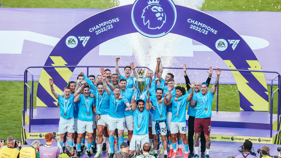 CHAMPIONS : Gundogan lifts the trophy aloft!