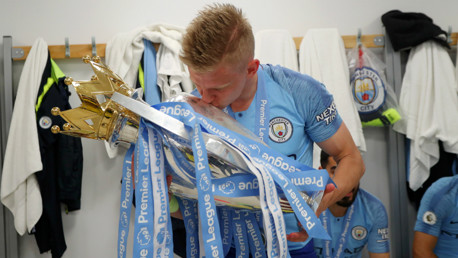 OURS: Oleks Zinchenko plants a kiss on the Premier League trophy.