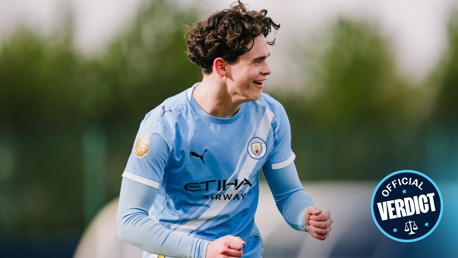 A football player in a Manchester City kit, focusing on a youth player wearing a light blue Etihad Airways jersey, without showing their face. The image includes text 'Official Verdict' and a Premier League logo.