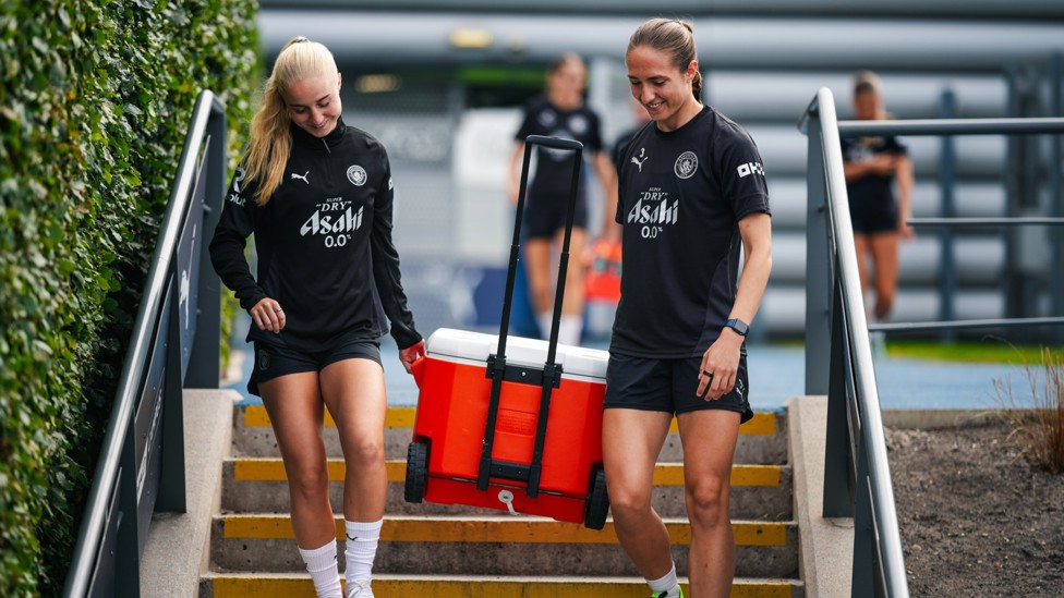 TEAMWORK  : Laura Blindkilde Brown and Naomi Layzell carry the essentials. 