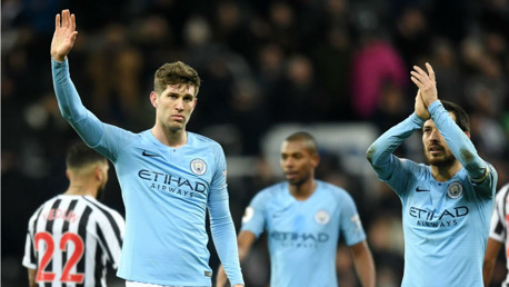 TOUGH NIGHT: A disappointed John Stones and David Silva salute the travelling City fans after the full time whistle