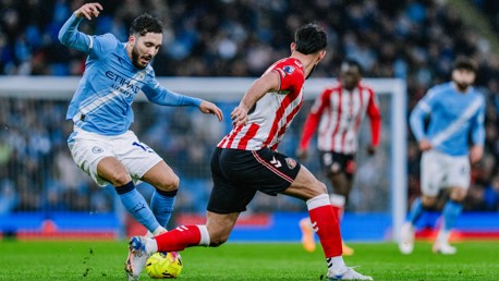 CHEEKY CHERKI: Shields the ball.