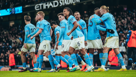 ALL SMILES: The players show their delight after the splendid goal.