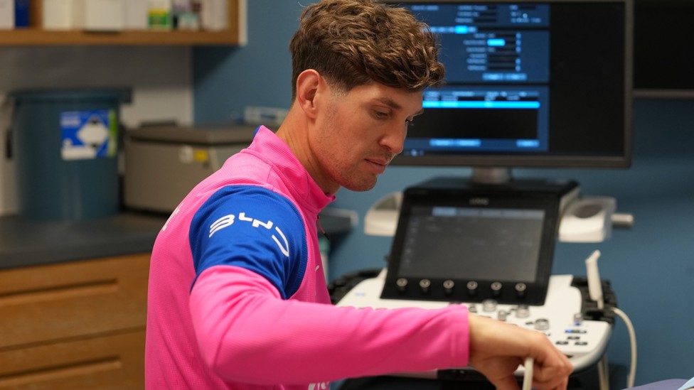 JOHN STONES: Our much-loved defender helping out in the treatment room - as you do!