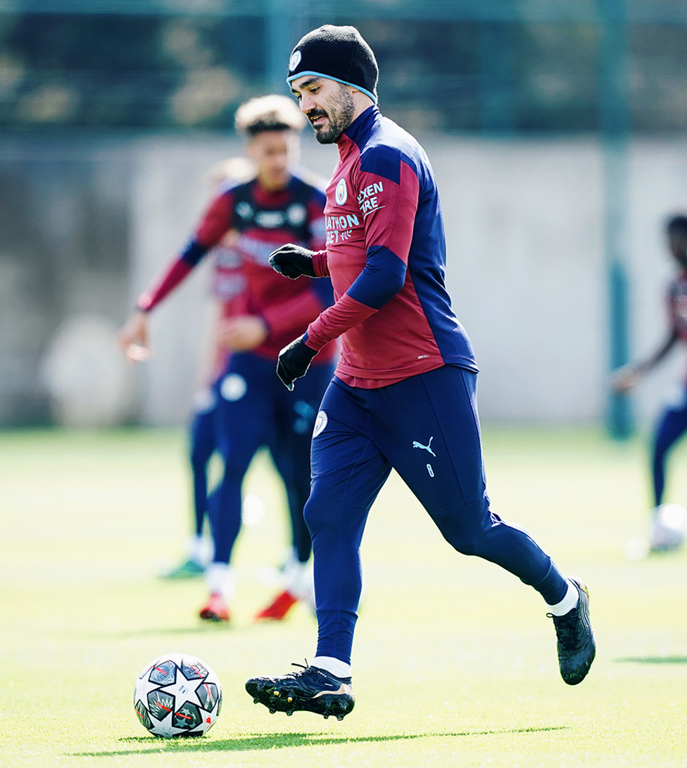 HAT TRICK! Ilkay Gundogan kept out the April chill with some nifty City headwear