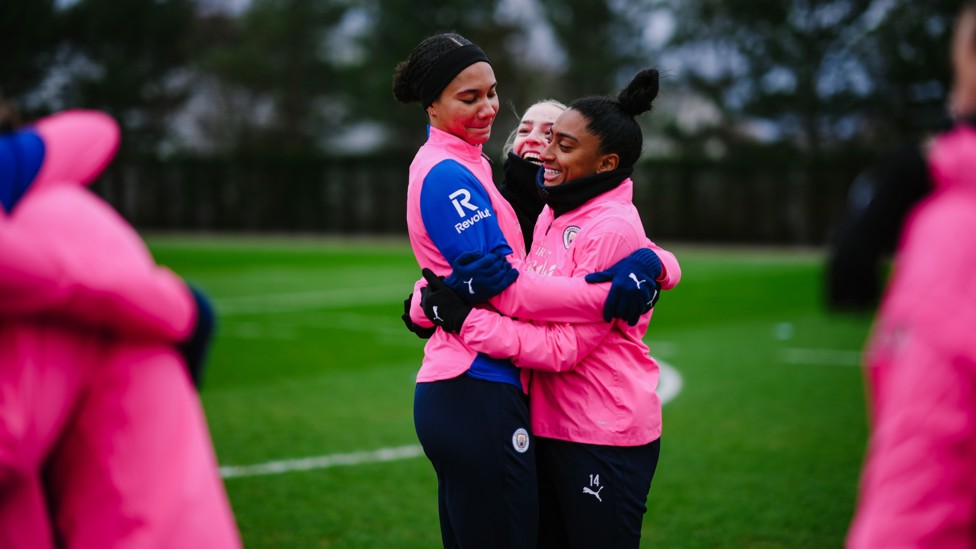 HUGS ALL ROUND : Jade Rose, Codie Thomas and Kerolin embrace just a warm up game