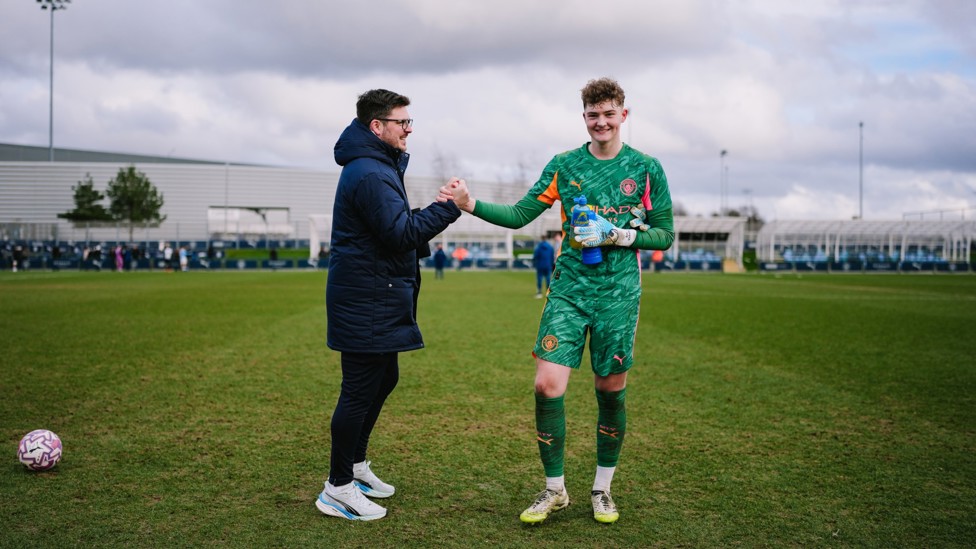 CELEBRATIONS ALL ROUND : Ben Vickery and goalkeeping coach Joe Peterson celebrate City's win.