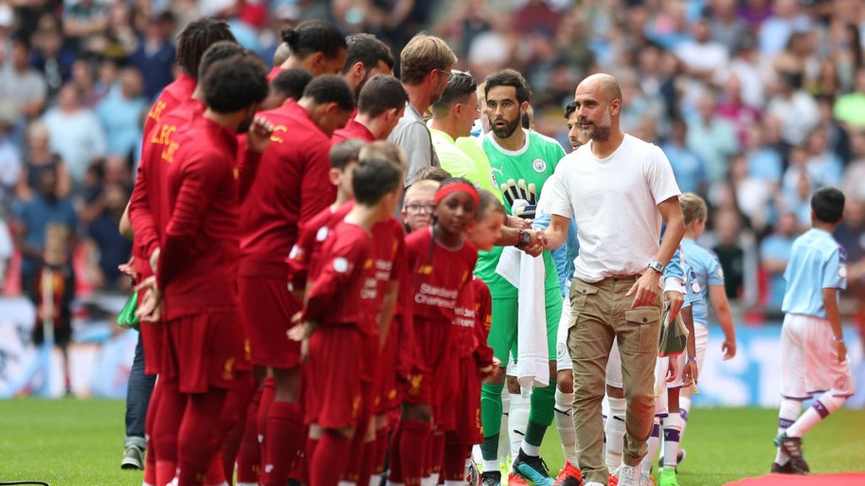 HANDSHAKES : City and Liverpool get the season's curtain raiser underway.