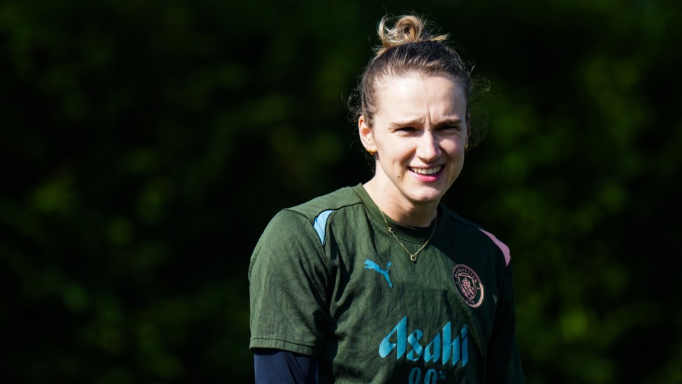 ALL SMILES : Vivianne Miedema watches on in the sun.