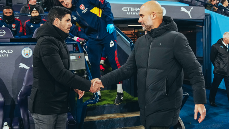 BOSSES: Guardiola and Arteta share a warm handshake ahead of kick-off.