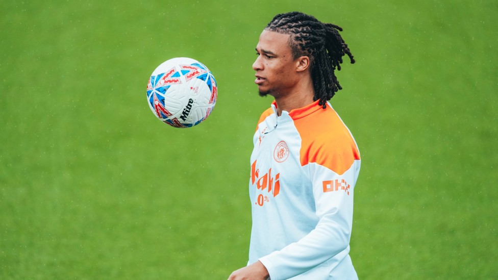 EYES ON THE PRIZE : Nathan Ake watches the ball come down