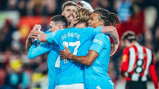 GROUP HUG: Foden feels the love!