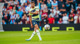 GAME TIME: Dias plays the ball forward.
