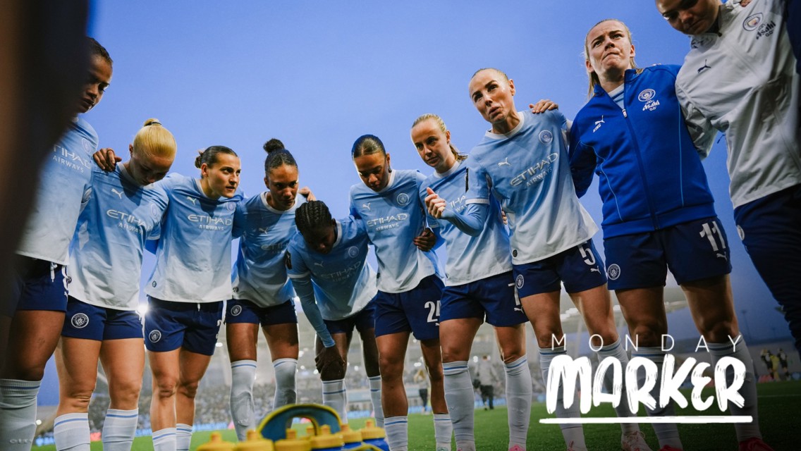 The Manchester City women's soccer team in light blue kits with 'Etihad Airways' logo are gathered in a huddle on a field with a blue sky background. The text 'Monday Marker' is overlaid.