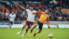 MIDFIELD BATTLE: Nunes contests for the ball.