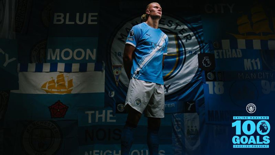 Erling Haaland is wearing a Manchester City kit, with Manchester City crests and banners in the background. Highlighting 100 goals achievement.