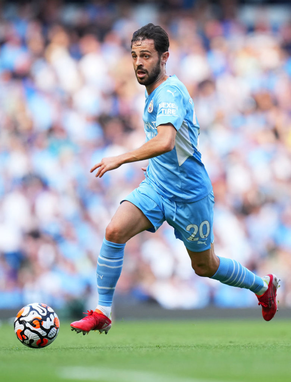 PACE TO BERN : Silva marches up the pitch.