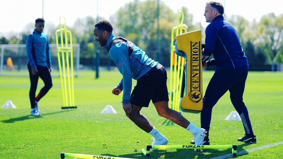 STEPPING FORWARD : Raheem Sterling works his way through a drill.