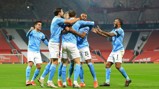 SQUAD GOALS: The lads celebrate with Stones