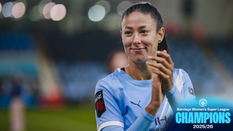 A Manchester City Women player clapping with text overlay: 'Barclays Women's Super League Champions 2025/26.'